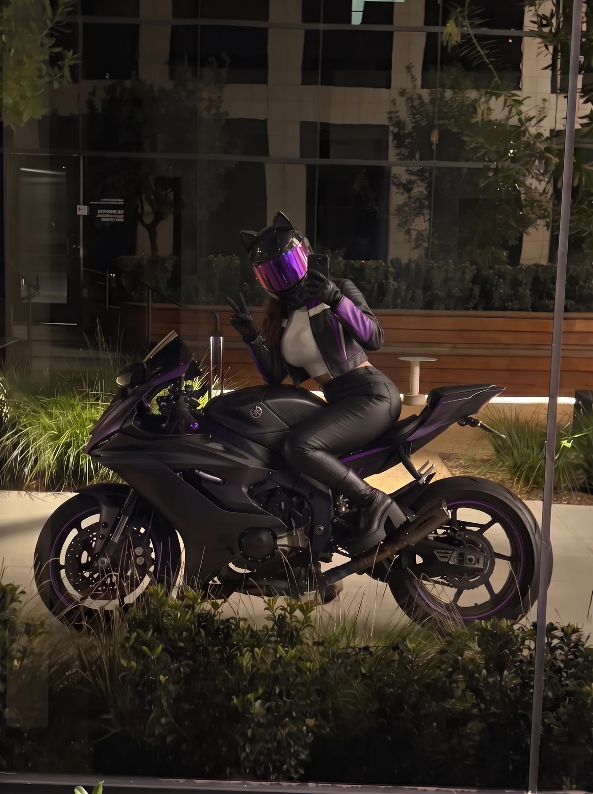 Amy on her black and purple motorcycle